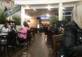 Image of some of the tables at the restaurant and showing how spacious the restaurant is.