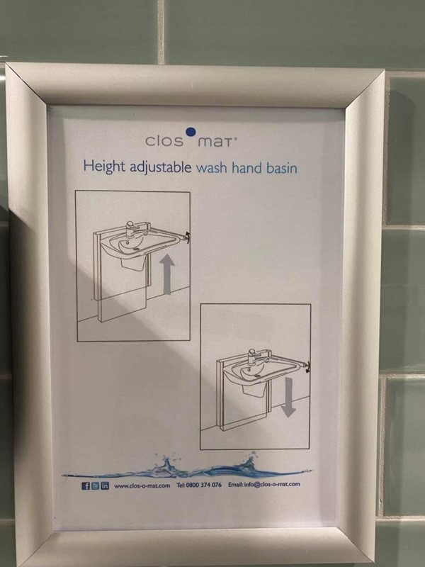Sign for height adjustable basin