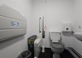 Image of an accessible toilet and changing bed