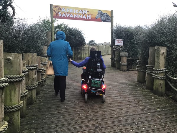 Grandma and grandson enjoying a stroll together.