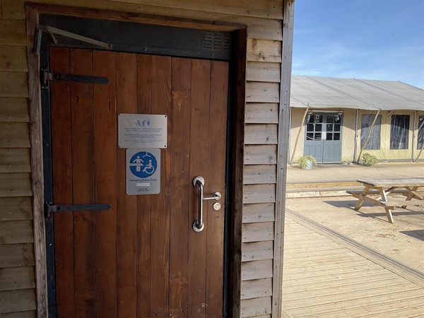 Image of a Changing Places sign on a door.