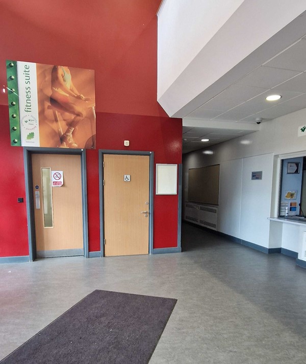 Accessible toilet to left of entrance in the building.