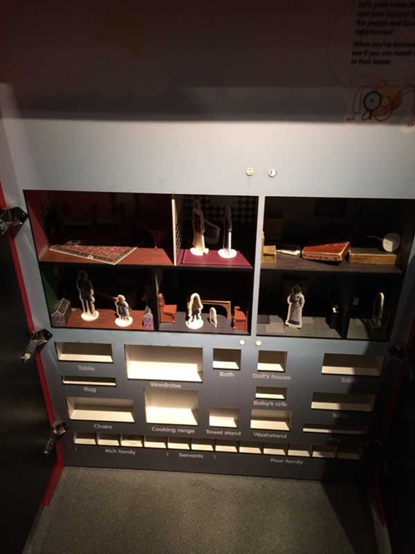 Interactive doll house exhibit