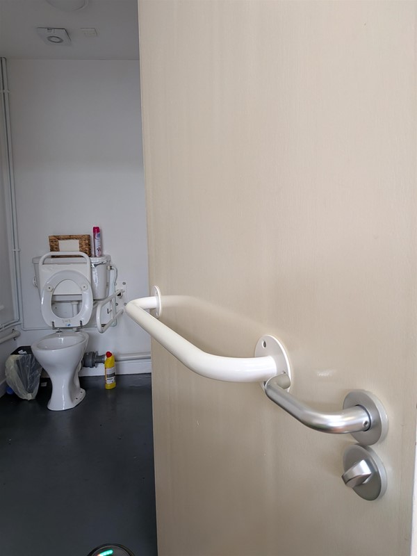 image of the inside of the door to the accessible bathroom