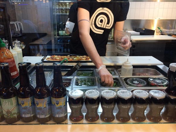 Photo of toppings being added.