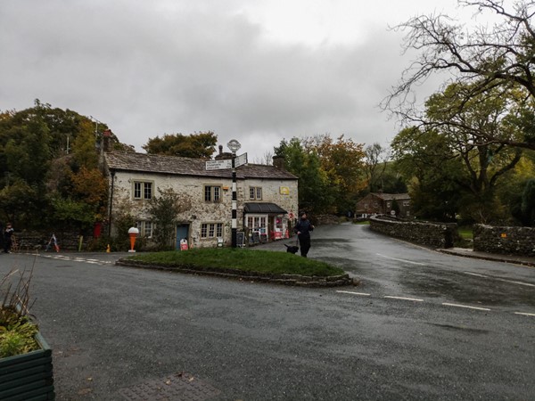 Signpost in the middle of Malham Village on the road up to the cove.