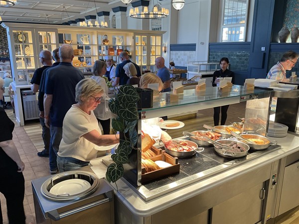 Image of people at a breakfast buffet